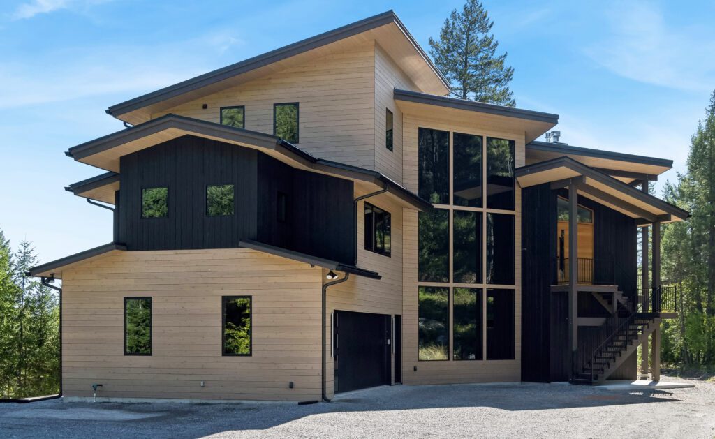 A combination of black and natural cedar wood siding on a modern home provides a sharp contrast for a bold, architectural look.