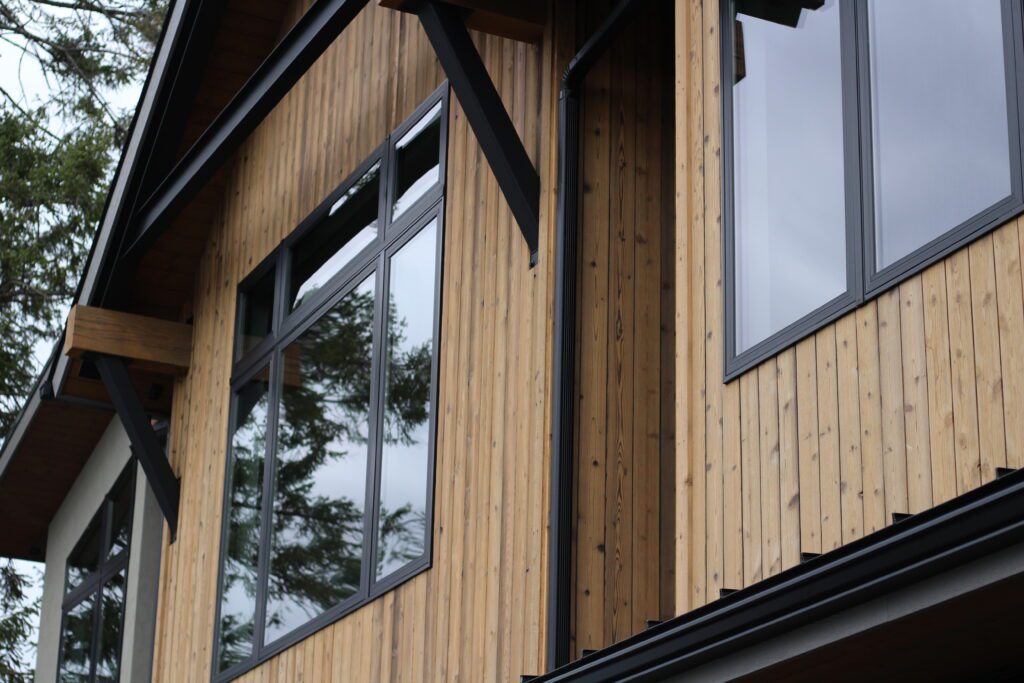 A home with pale cedar wood siding brings organic beauty and depth to the home’s facade.