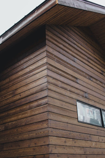 The exterior of a home featuring charred wood siding, showcasing the deep texture of Shou Sugi Ban.