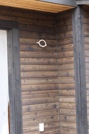 Charred wood siding adds a timeless, architectural statement to the exterior of a modern custom home.