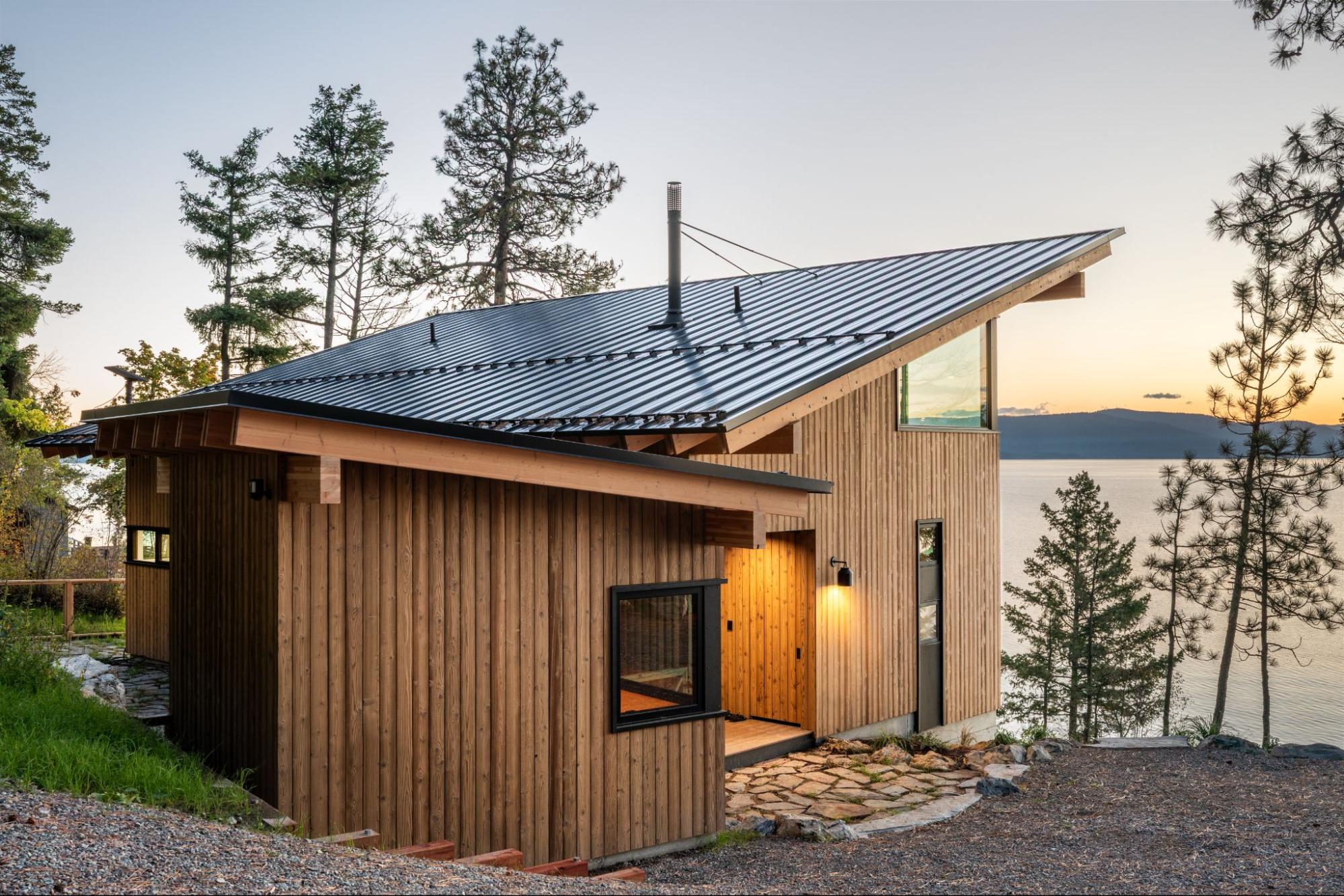 A modern lakeside cabin finished in warm honey and rich brown tones.
